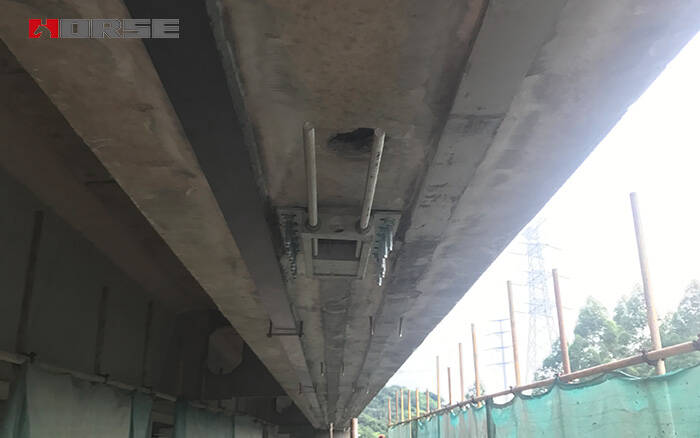 Prestressed FRP strip supporting bridge