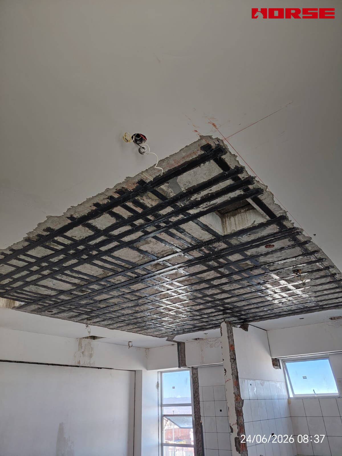 Carbon Fiber Plate Strengthening of RC Slabs with Openings
