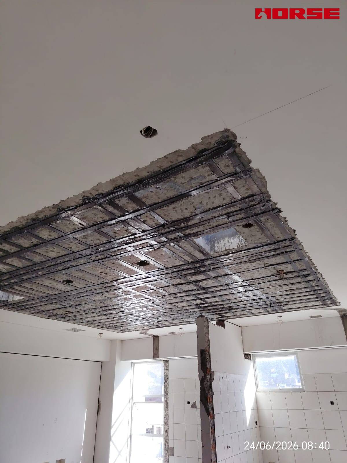 Carbon Fiber Plate Strengthening of RC Slabs with Openings