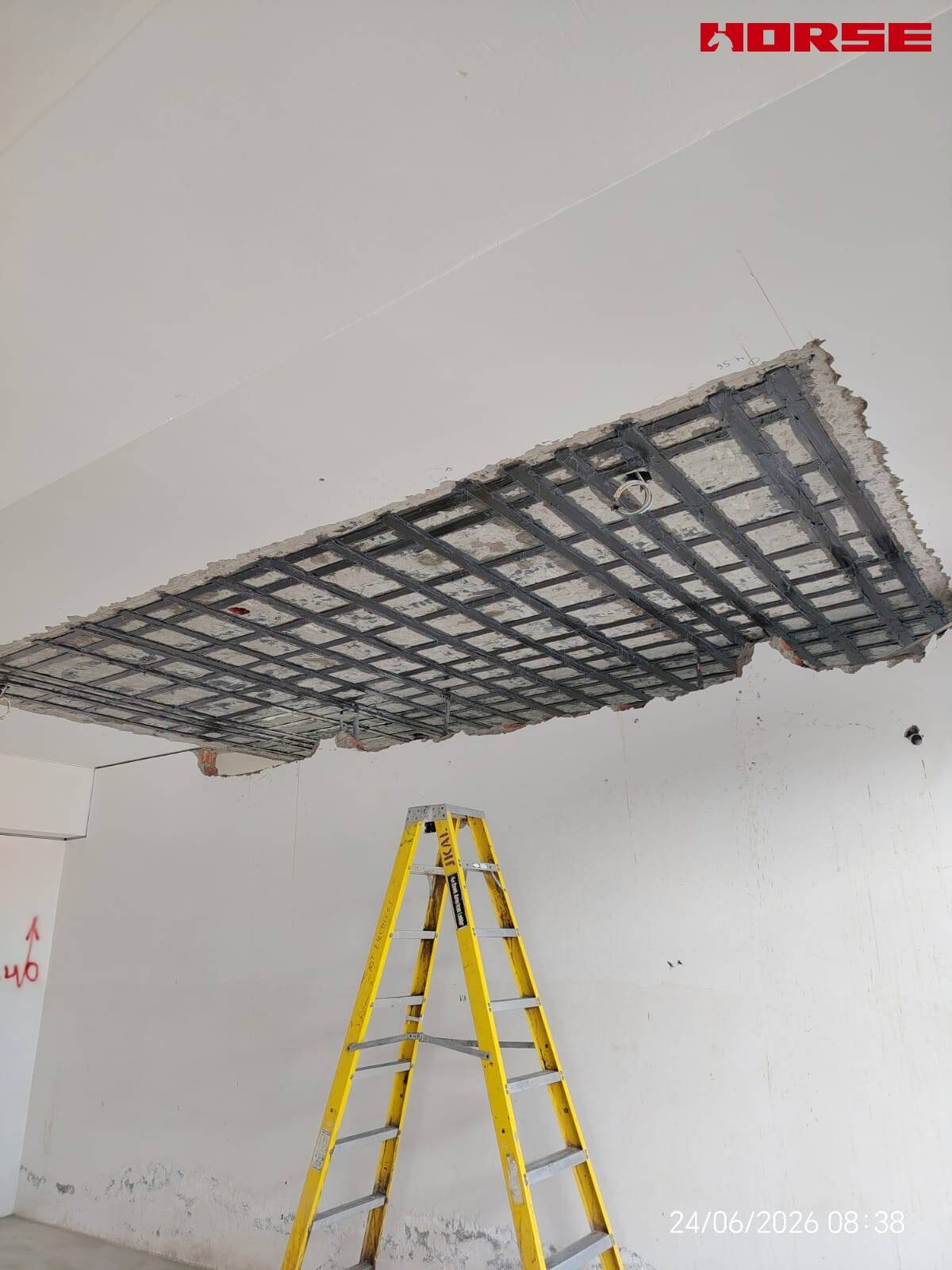 Carbon Fiber Plate Strengthening of RC Slabs with Openings