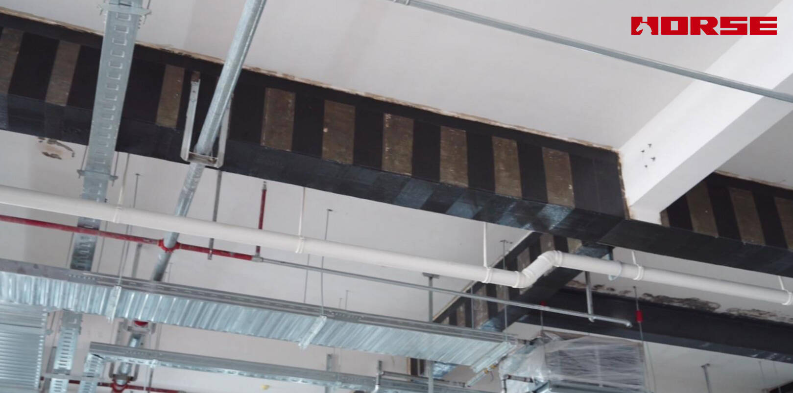 Structural Retrofit with Carbon Fiber after Floor Slab Demolition